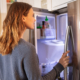 Person getting food from their freezer in their apartment