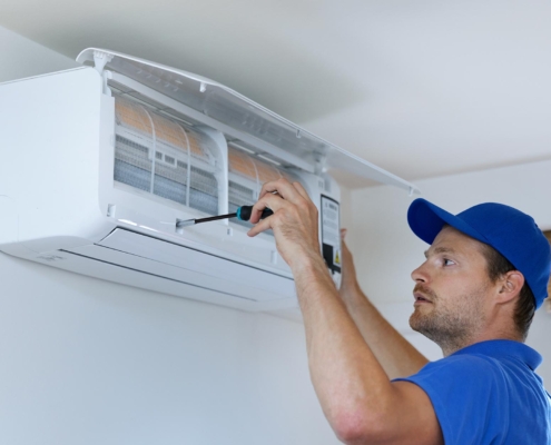 Worker repairing HVAC system