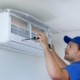 Worker repairing HVAC system