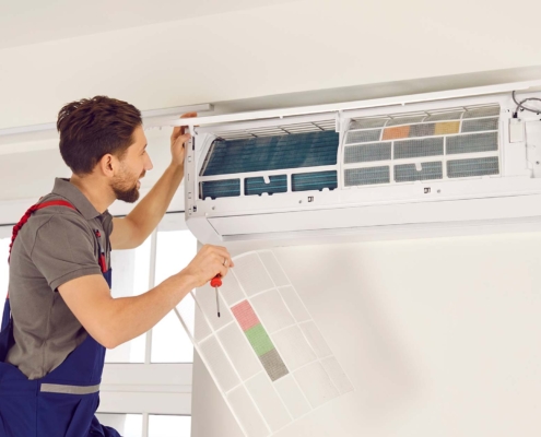 professional replacing hvac filter